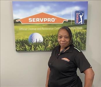 Female SERVPRO employee Peggie Carroll is shown in front of logo 
