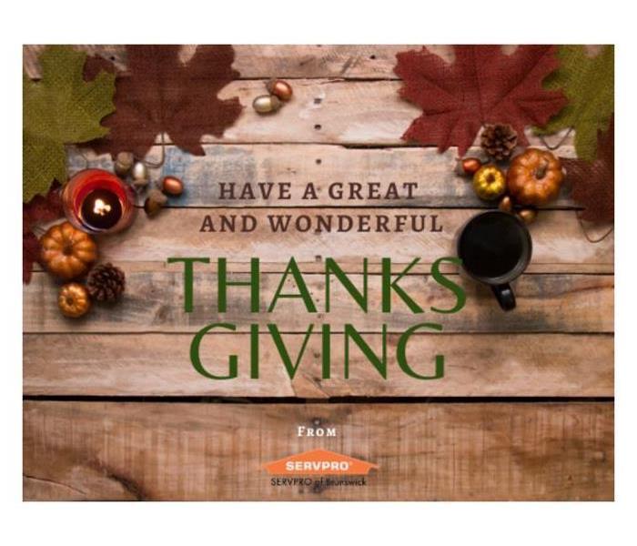 Wooden planks with burgundy and green leaves and pumpkins. Reads “Have a great and wonderful thanksgiving from SERVPRO”