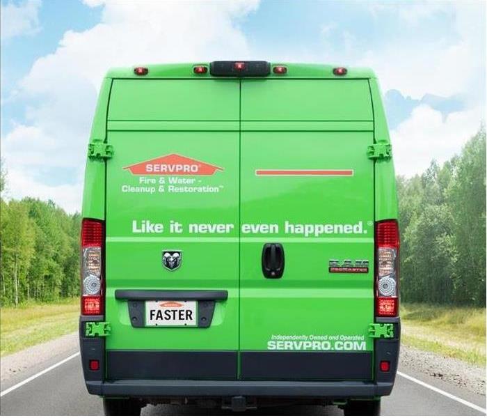 A green SERVPRO van is shown 