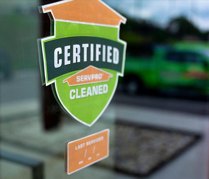 Certified: SERVPRO Cleaned Sticker on Window of a Retail Store