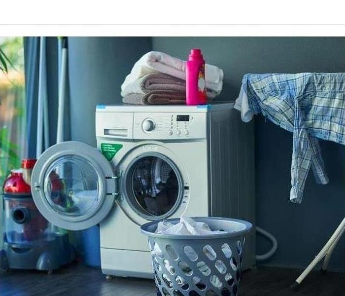 A laundry room is shown 